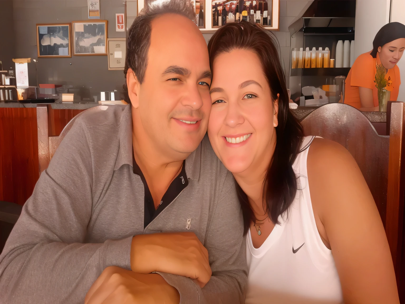 A couple sitting at the table with a glass of wine, mom and dad, happy couple, in São Paulo, profile image. Woman in good physical shape. A woman with white skin and dark hair. She is about 35 years old. Her slightly plump red lips are like a delicate flower, her dark brown eyes seem to contain a world of wonders. Slim body. thin waist. Her body exudes glamor and her face is a definition of beauty. highly realistic, STILL, slightly plump lips, pink lipstick, Smile, feeling of lightness and joy, Hyper-realism, very elaborate skin, look. fitness woman. sharp photo, high quality, high resolution, art, 8k.