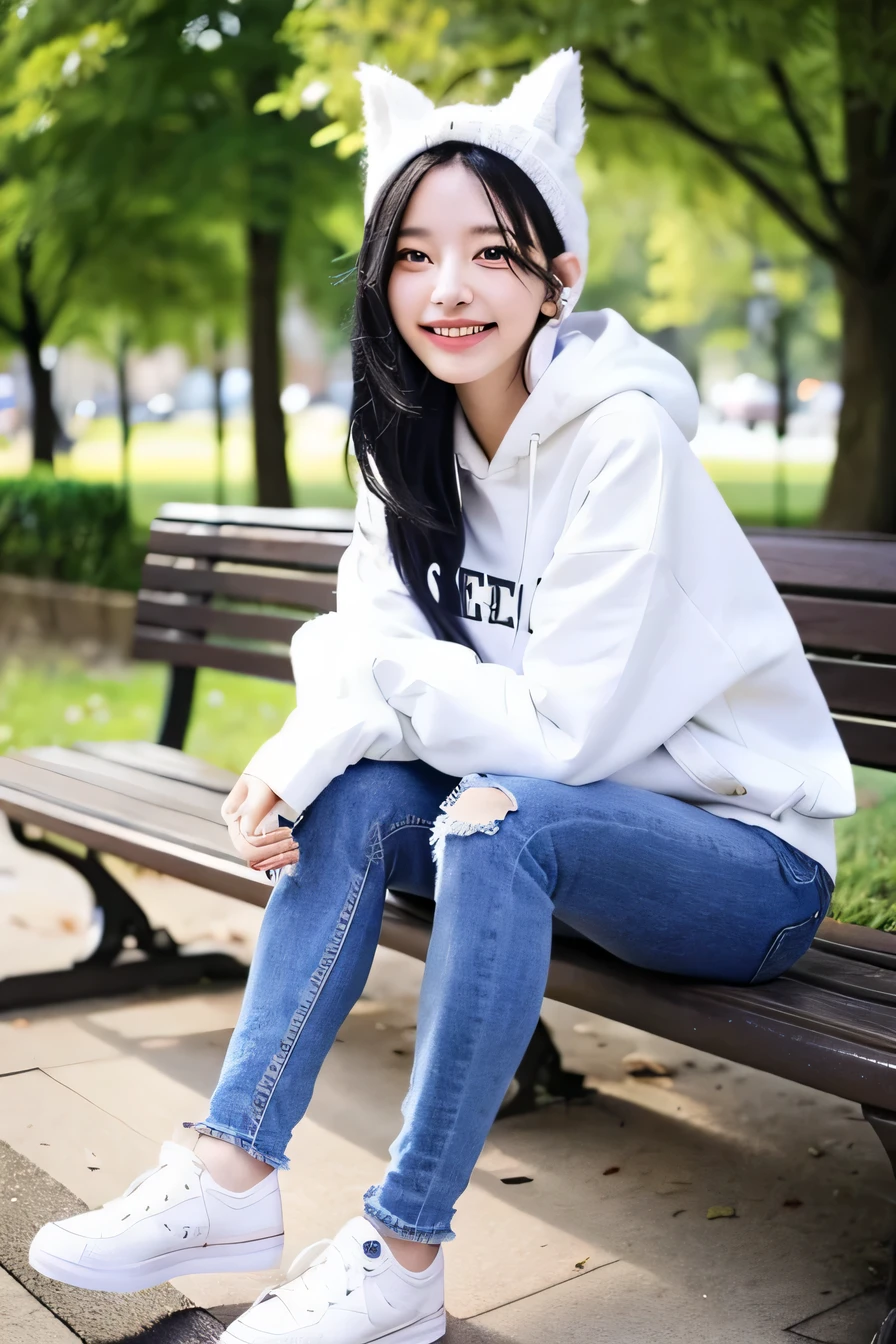 A neat and beautiful woman sitting on a park bench、black hair、hoodie、ear piercing、skinny denim、sneakers、smile。、beautiful teeth、full body photo