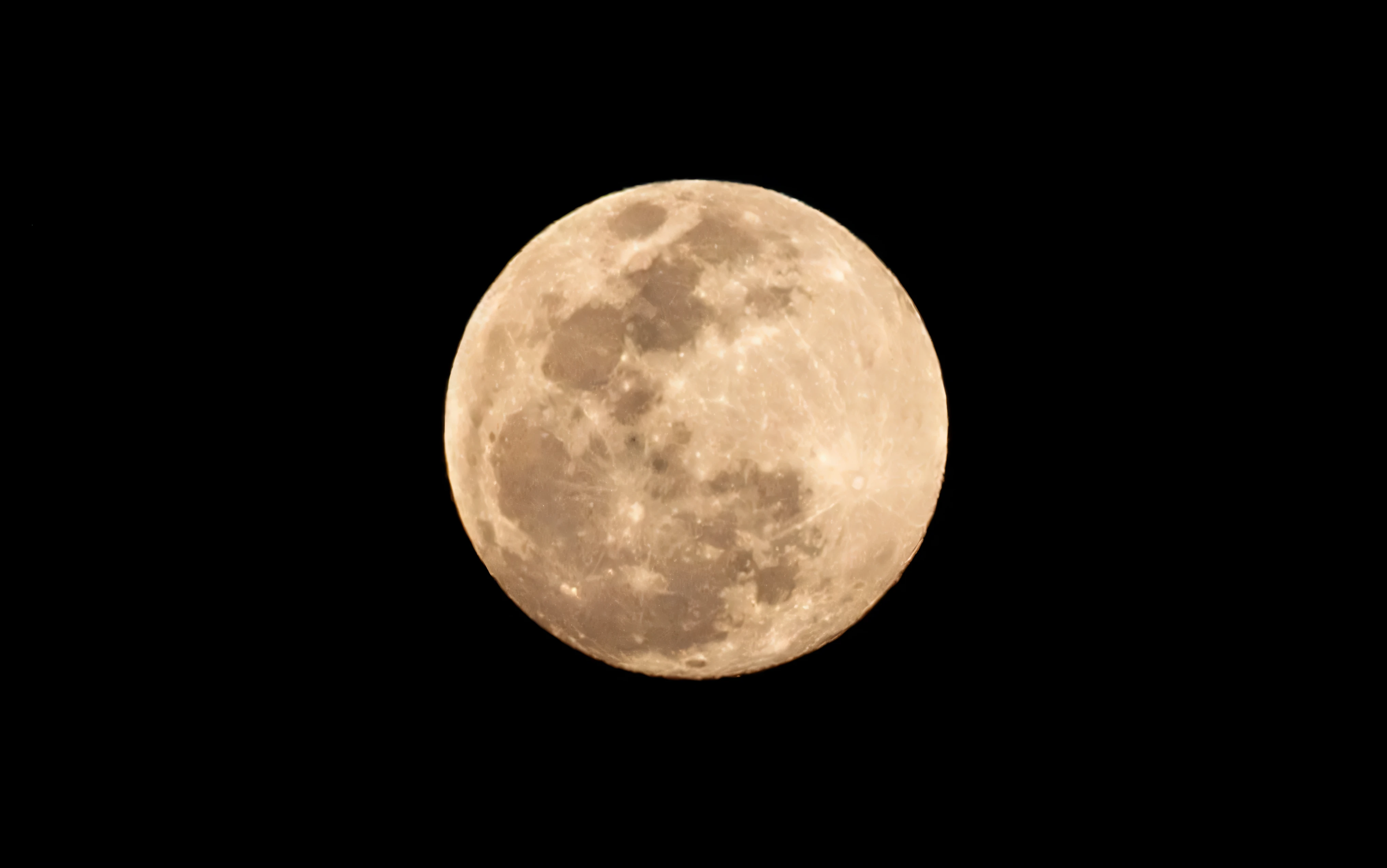 arafed view of a full moon with a black sky background, yellowish full moon, supermoon, big full moon, giant supermoon, full moon in background, full moon, full moon, full moon, large glowing moon, full moon in the background, circular white full moon, giant pink full moon, in front of a pale full moon