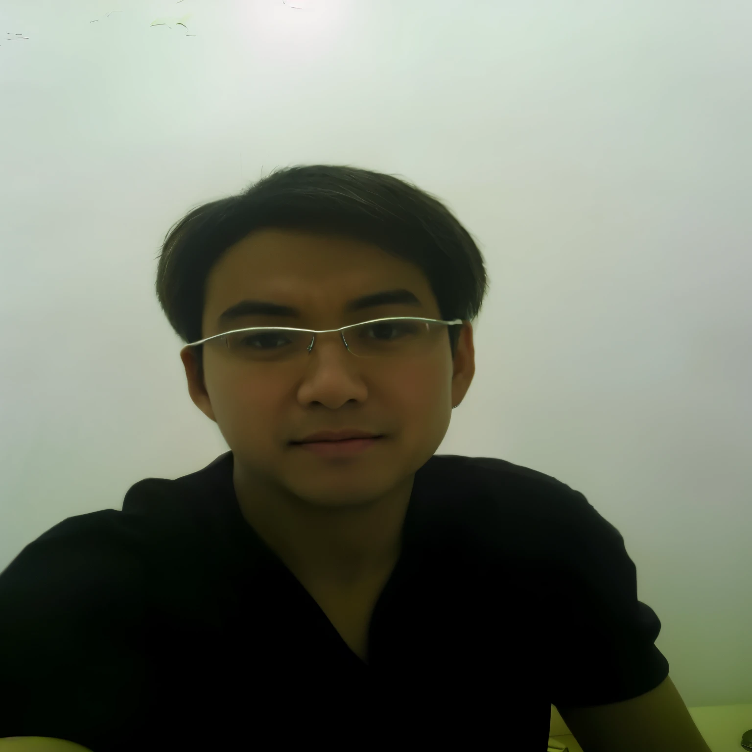 there is a man wearing glasses and a black shirt, with fog, low quality photograph, blurry image, with black eyeglasses, blurred photo, pov photo, inspired by Yeong-Hao Han, in a foggy office, selfie shot straight on angle, with glasses, inspired by David Diao, with glasses on, haze over the shoulder shot, inspired by Gao Cen