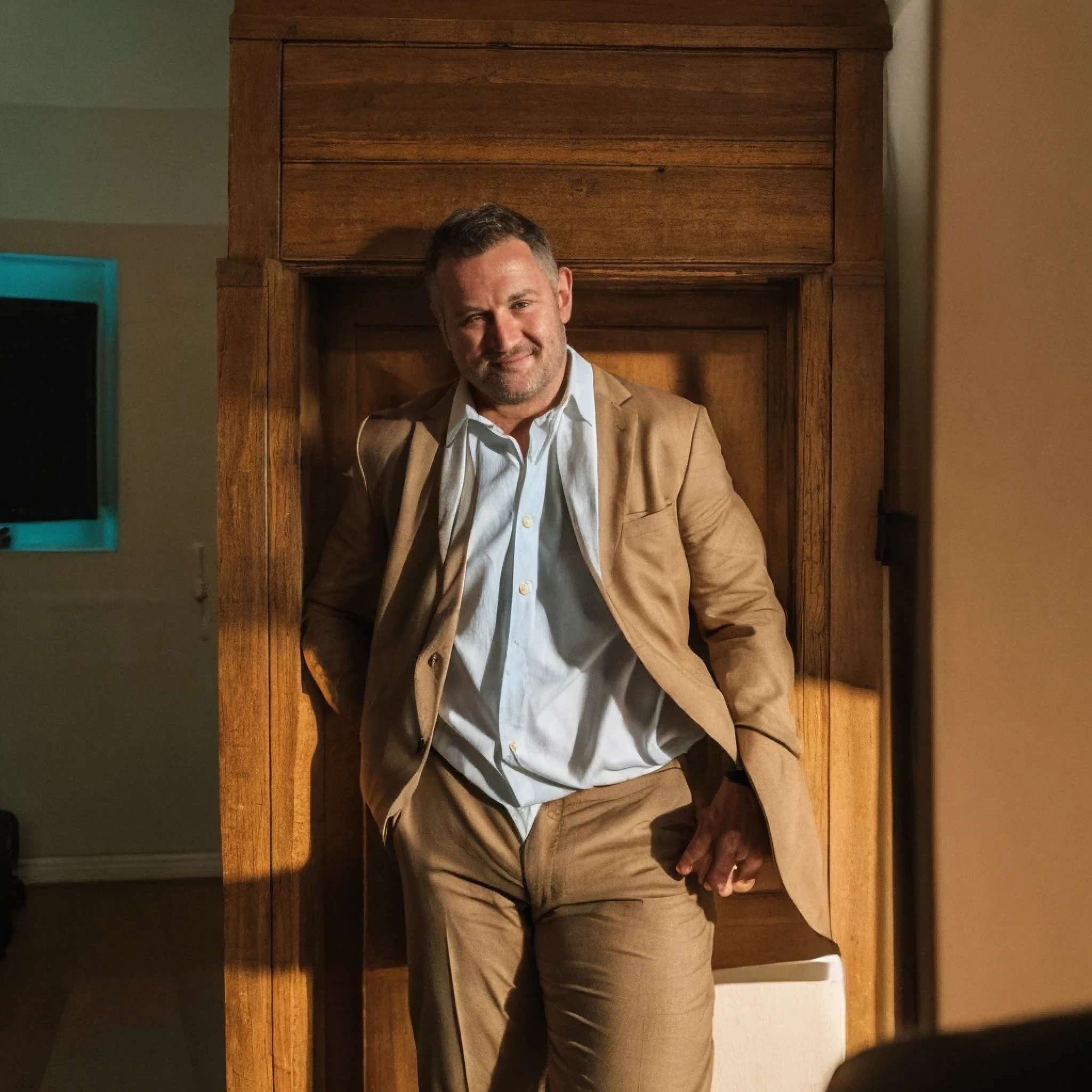 Certainly, here you go! color photo of a beefy businessman with an unbuttoned shirt that reveals his hairy chest, glistening with sweat, and his muscular arms that bulge with veins. He's wearing a thick gold chain that glimmers in the light, and his confident smirk suggests he knows he's in control. The background is a dimly lit office with wooden paneling on the walls and expensive artwork hanging. The atmosphere is tense, as if the businessman is about to make a deal that will change the course of his career. The camera used to capture this image is a vintage Nikon F3 with a 50mm lens, shooting on Kodak Portra 400 film. It was shot with a shallow depth of field to highlight the businessman's impressive physique. Some directors, cinematographers, photographers, fashion designers who would be unlikely to collaborate but would juxtapose uniquely include David Fincher, Emmanuel Lubezki, Annie Leibovitz, and Donatella Versace. --uplight --v 5.2 --ar 12:8 --zoom 1.4 RAW candid cinema,16mm,color graded portra 400 film,remarkable color,ultra realistic,textured skin,remarkable detailed pupils,realistic dull skin noise,visible skin detail,skin fuzz,dry skin,shot with cinematic camera