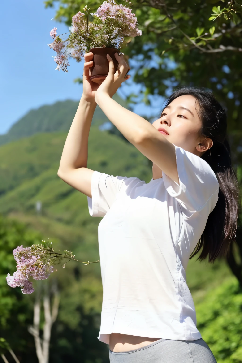 A woman wearing comfortable clothes does morning exercises outdoors,A park or mountain forest with blooming flowers in the background,Holding mugwort green balls in hand or doing yoga poses