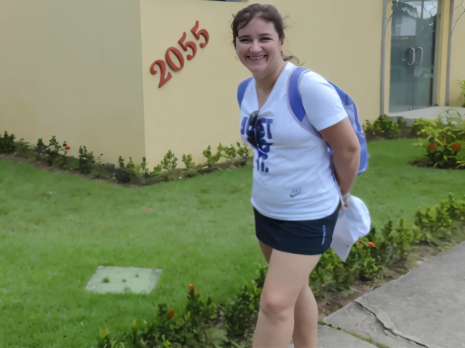 smiling woman in a white shirt and black shorts standing on the sidewalk, student, walking proudly down the street, in front of an inn, in the background, beautiful scenery. She is 155 cm tall and around 40 years old. A woman with tanned white skin and dark hair. She is around 40 years old. She has slightly full lips and dark brown eyes. Perfect body, slim body, slim waist. tanned skin, soft lips, red lipstick, a feeling of lightness and joy, hyperrealism, very elaborate skin. Fitness woman, fit woman, physically fit woman, full body photo, clear photo, high quality, high resolution, masterpiece, 8K.