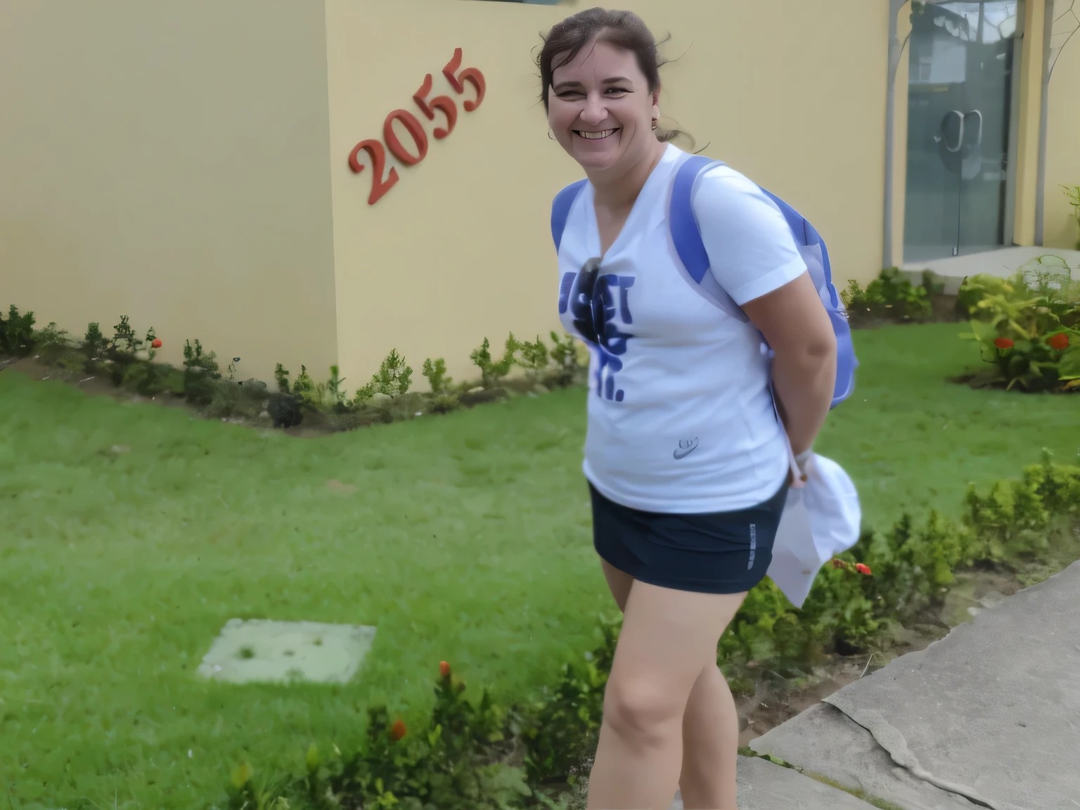 smiling woman in a white shirt and black shorts standing on the sidewalk, student, walking proudly down the street, in front of an inn, in the background, beautiful scenery. She is 155 cm tall and around 40 years old. A woman with tanned white skin and dark hair. She is around 40 years old. She has slightly full lips and dark brown eyes. Perfect body, slim body, slim waist. tanned skin, soft lips, red lipstick, a feeling of lightness and joy, hyperrealism, very elaborate skin. Fitness woman, fit woman, physically fit woman, full body photo, clear photo, high quality, high resolution, masterpiece, 8K.