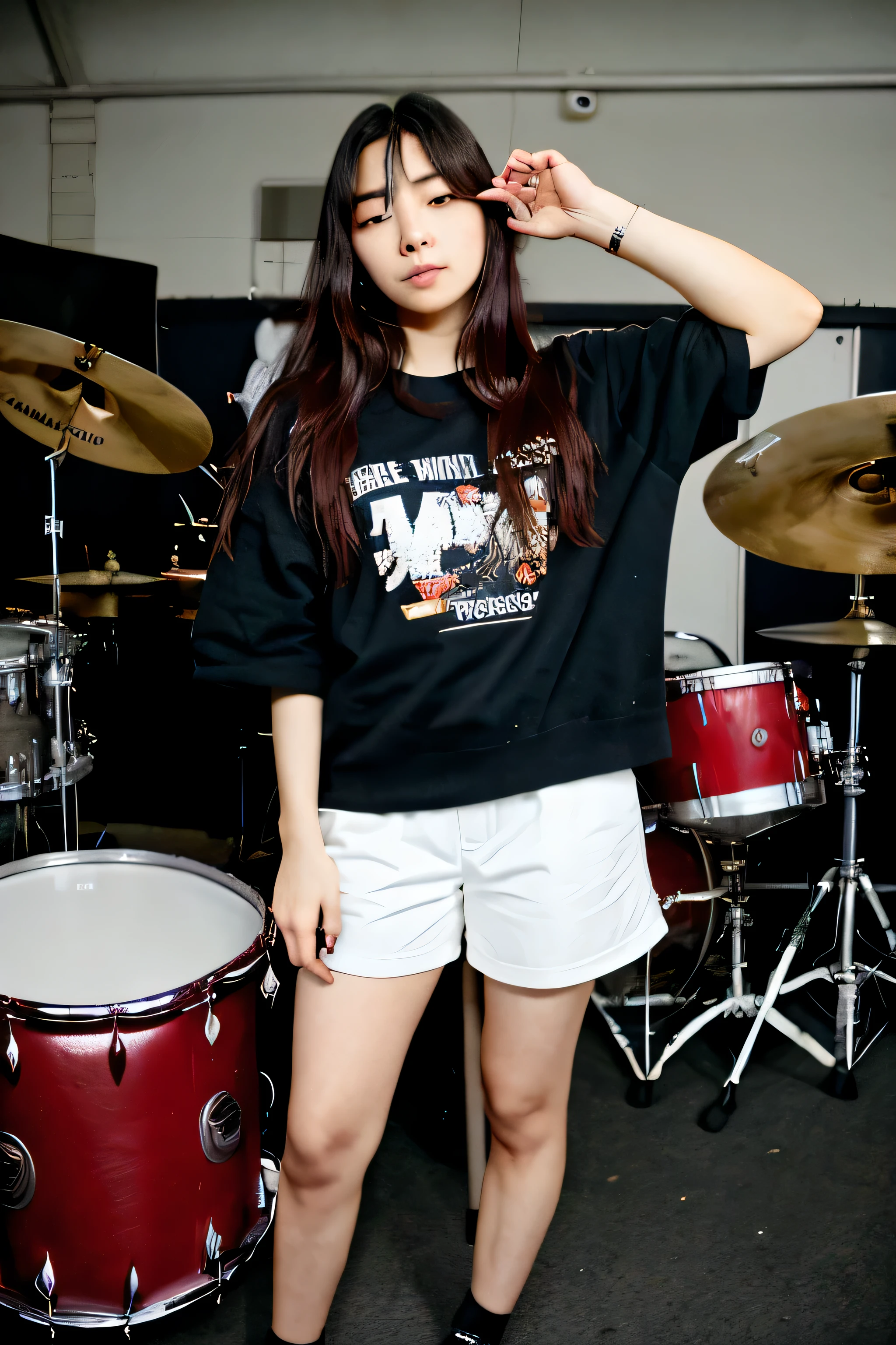 seulgi from red velvet is wearing baggy clothes while holding a drummer's stick in a band room and her head and body should be facing the other side but the drum sticks are still visible
