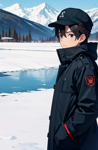 a boy in a square near a lake looking at the lake wearing a cold coat and a hat and gloves when snow falls