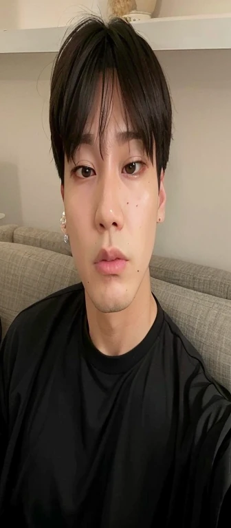 there is a man sitting on a sofa with a cell phone, Jimin\the right eyelid is swollen, hyung tae, taejune kim, Jungkook, Kim Doyoung, park Jimin, Jimin\the full lips, Hong junho hyung, Shin Jeongho, cai xukun, brilhante da chuva, hyung tae kim, Jimin\o nariz grego