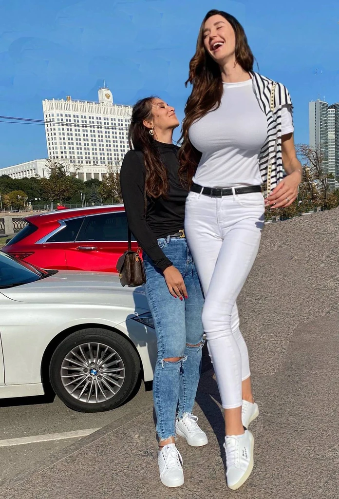 plain white shirt, (big giant enormous oversized massive huge colossal:1.5), (gigantic sagging breasts:1.5), (very long wavy hair), striped towel over shoulder
