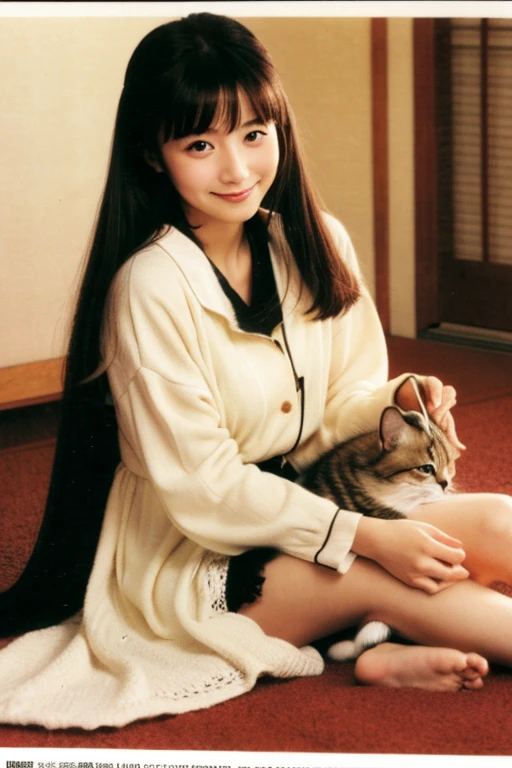 A super beautiful Japanese woman playing with a kitten