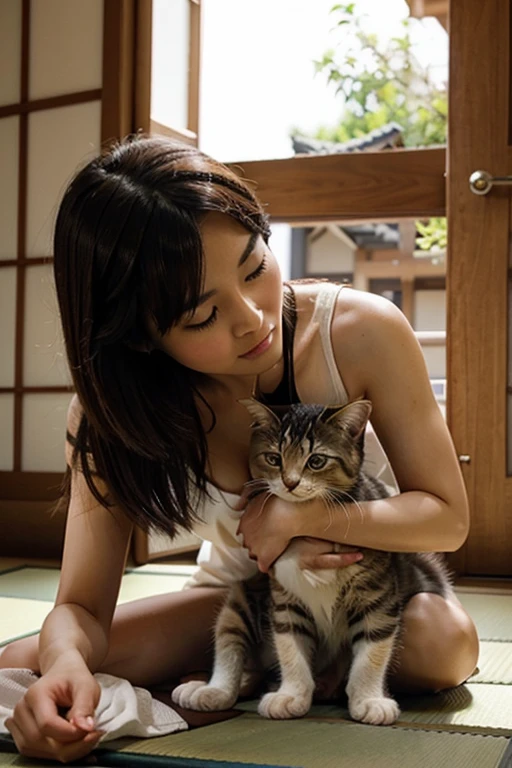 A super beautiful Japanese woman playing with a kitten