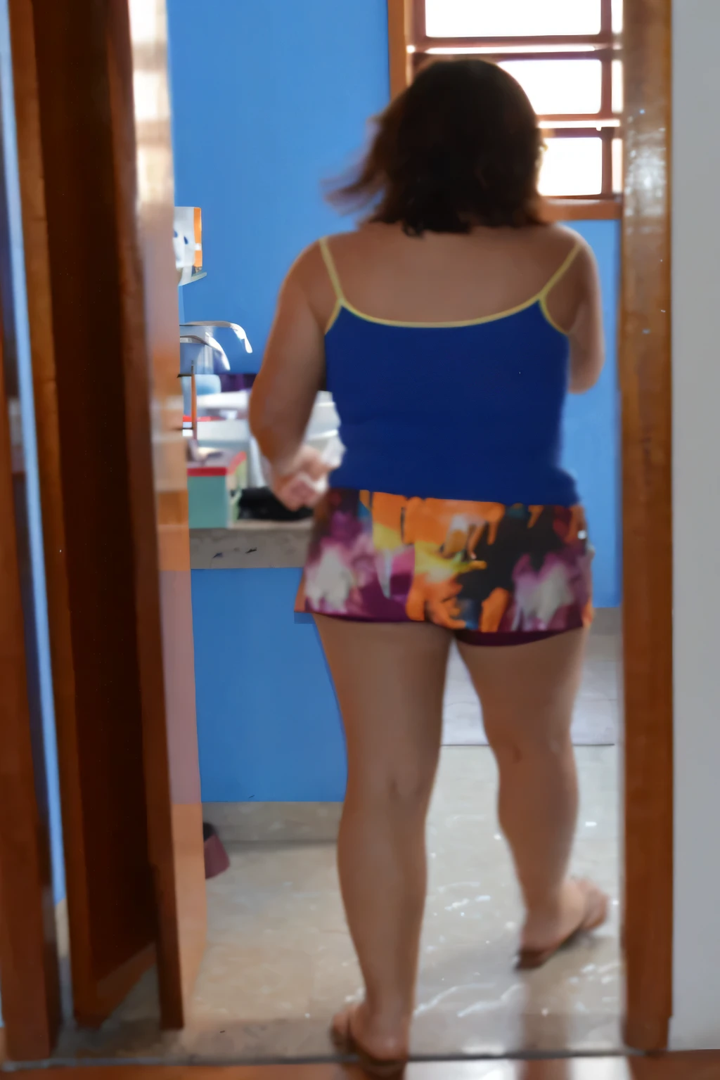 there is a woman standing in a doorway with a blue shirt, wearing a camisole and shorts, in shorts, wearing a tank top and shorts, dressed in a top and shorts, uhd candid photo of dirty, distant full body view, full length view, short shorts, side shot, view from behind mirror, middle shot waist up, colorful outfit