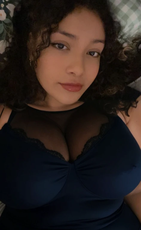 there is a woman laying in bed with a cell phone, taken in the early 2020s, profile image, around 1 , selfie of a young woman, 18 years old, alanis guillen, headshot profile picture, profile pic, 30 years old woman, 3 0 years old woman, her face framed with curls, Big tits, huge tits, no clothes, sexy, cute, minimal clothes, thick, bbw, chubby stomach, thick nipples, nipple piercings, large areola, hard nipples, piercing through shirt, nipples hard through shirt, busty, major cleavage, naked, ripping through top, spilling over sides, bra too tight, giant tits, extra wide hips, upper body zoom in, showing off huge , fat stomach, see through top, fat bbw, large areola showing, major cleavage, latina, down to stomach, wide hips, sexy, upper body zoom, thick arm, showing off , top half only, showing only upper, only a bra, showing off cleavage