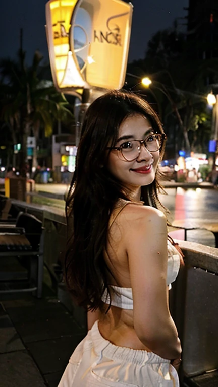 Create a photorealistic image shot with an iPhone10. A picture of a pretty 30 year old Malaysian woman standing on a beach at night. You can see her from her head to her feet. She has long slightly wavy hair and is wearing glasses. She is standing with her back to the camera. You can not see her face. She is holding a towel that covers only half her bum. She is topless. You can see her from her head to her feet. She is laughing and appears slightly drunk.