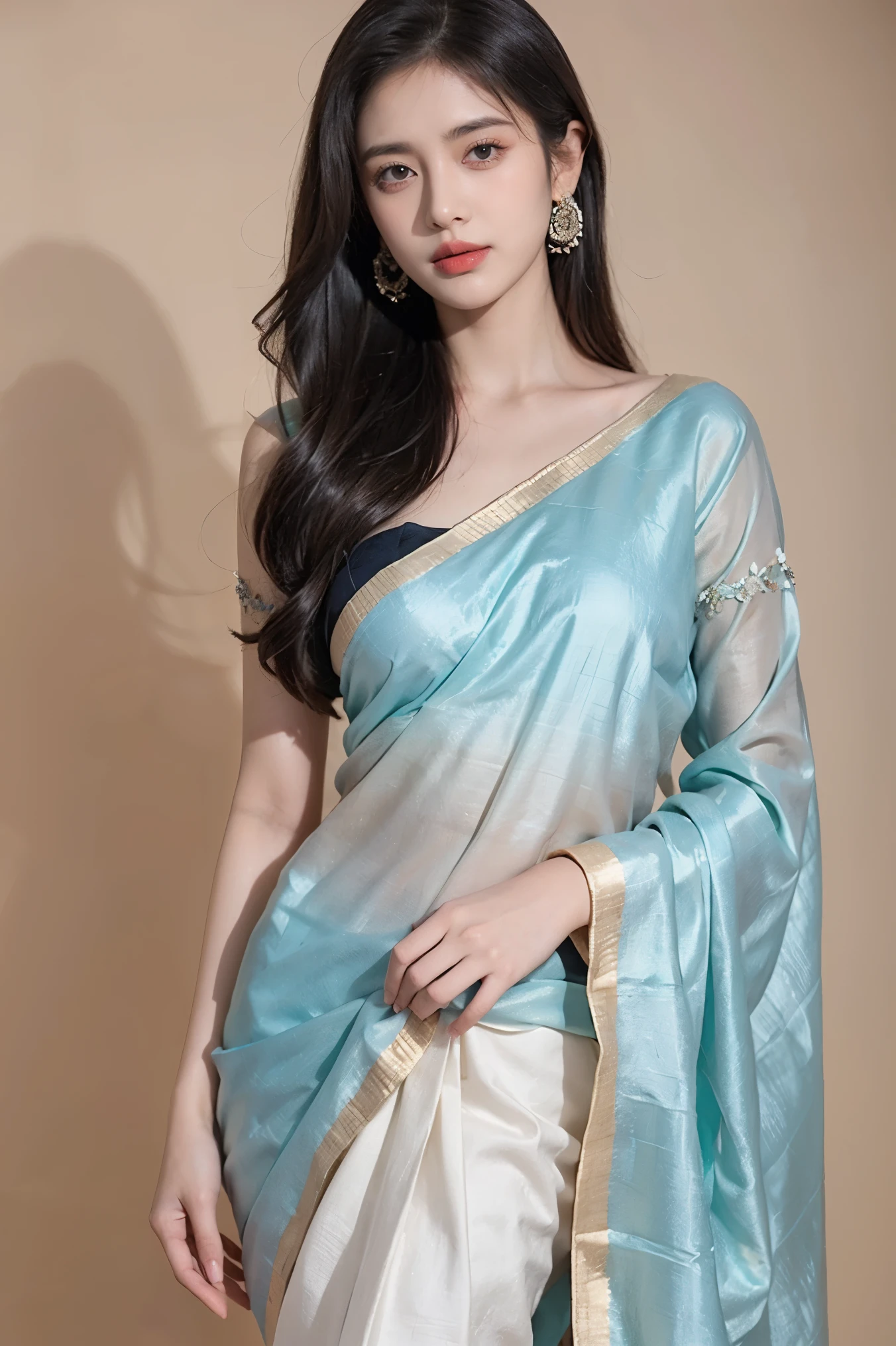 White tie-dyed silk saree with white, brown and aquamarine Nakshi Kantha embroidery. Comes with matching unstitched blouse piece attached at the end of saree. Blouse shown in the photo is a styling suggestion, it is not a part of the actual product.