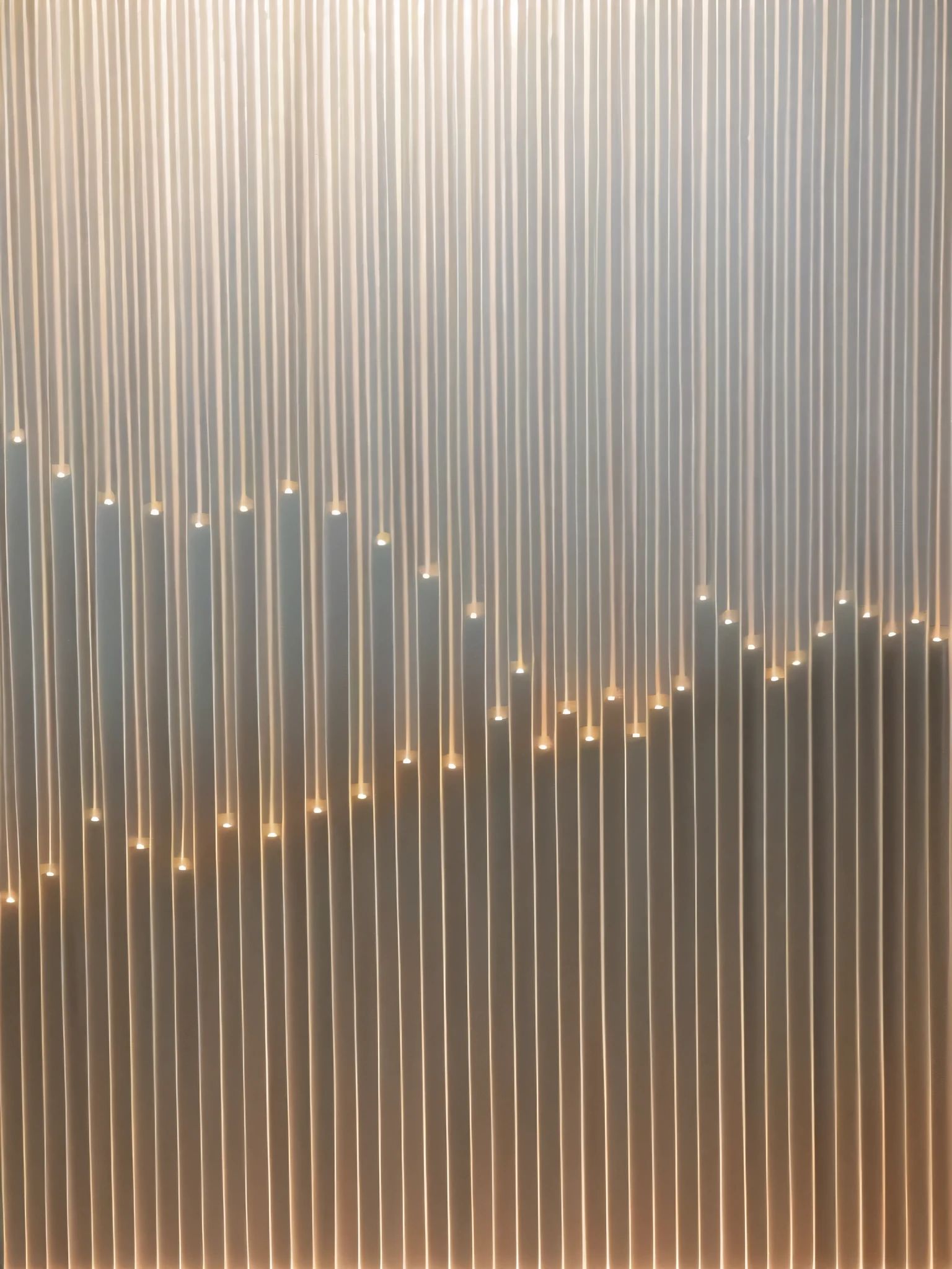 There is a toilet in the bathroom，Curtains hanging on the wall, 灯light, light wave, Caustic lighting from above, light, Inspired by Ryoji Ikeda, Lighting line, intricate Lighting line, Glowing thin line, diffuse light, Thin glowing lights, Vertical line, Inspired by Lucio Fontana, 发light, Glowing lamps intricate