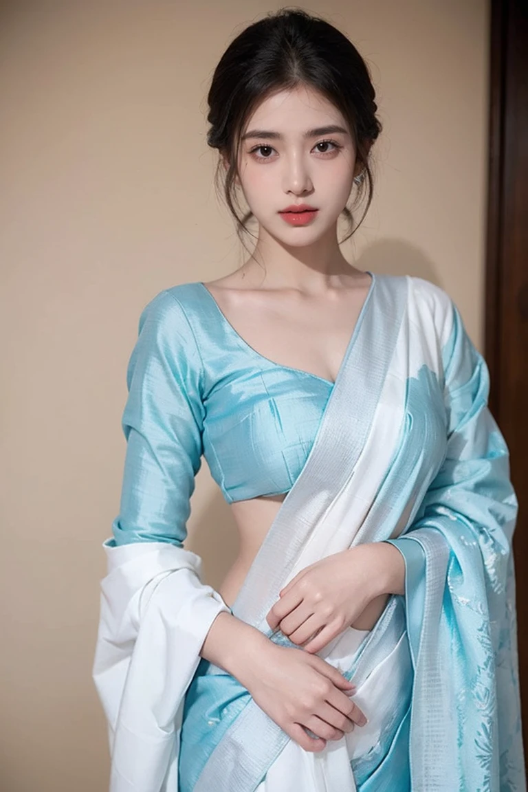 White tie-dyed silk saree with white, brown and aquamarine Nakshi Kantha embroidery. Comes with matching unstitched blouse piece attached at the end of saree. Blouse shown in the photo is a styling suggestion, it is not a part of the actual product.