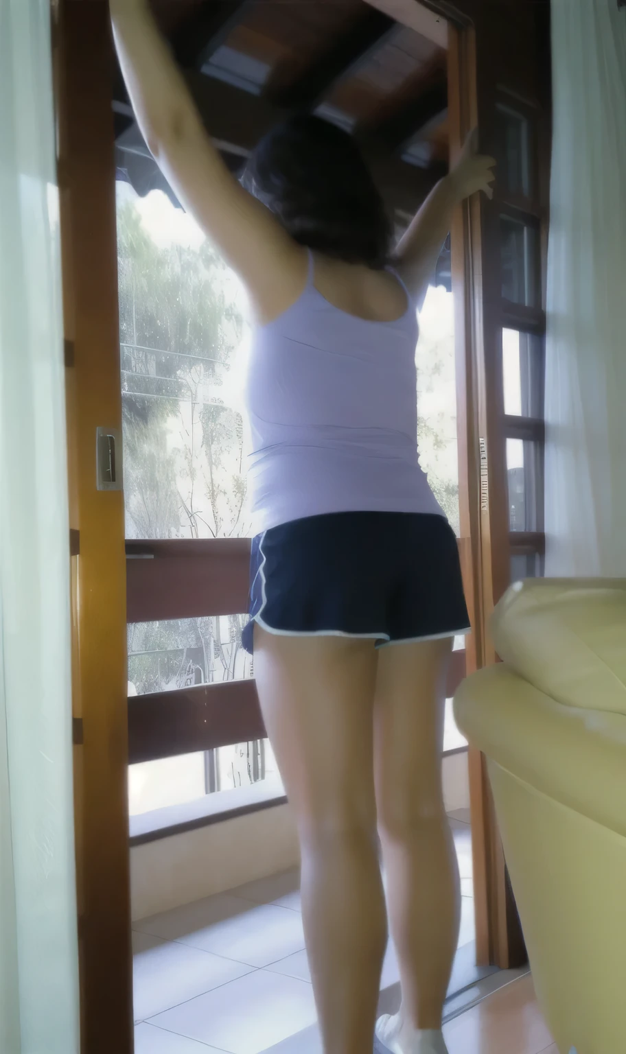 There is a brunette woman standing on a balcony, in a room, in very short and tight shorts, side photo, shot from the back, thighs exposed!!!, photo of the waist, wide photo of the full body, photo taken from behind, fitted photo, plump thighs, in good physical shape, fitness, high quality photo, high resolution, masterpiece, 8k.