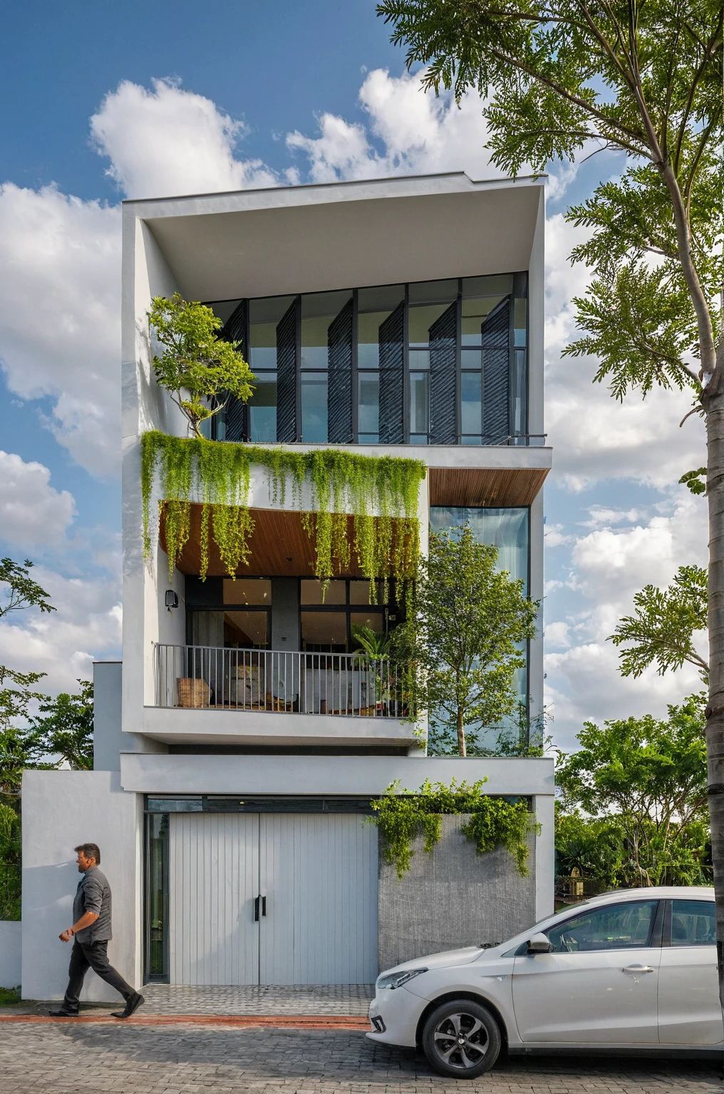 Masterpiece, high quality, best quality, authentic, super detail, outdoors, onestoreyvillaXL, aiaigroup, house style modern on the street ,stairs, white wall ,road,pavement, grass, trees, sky, cloud, (daylight:1.1)