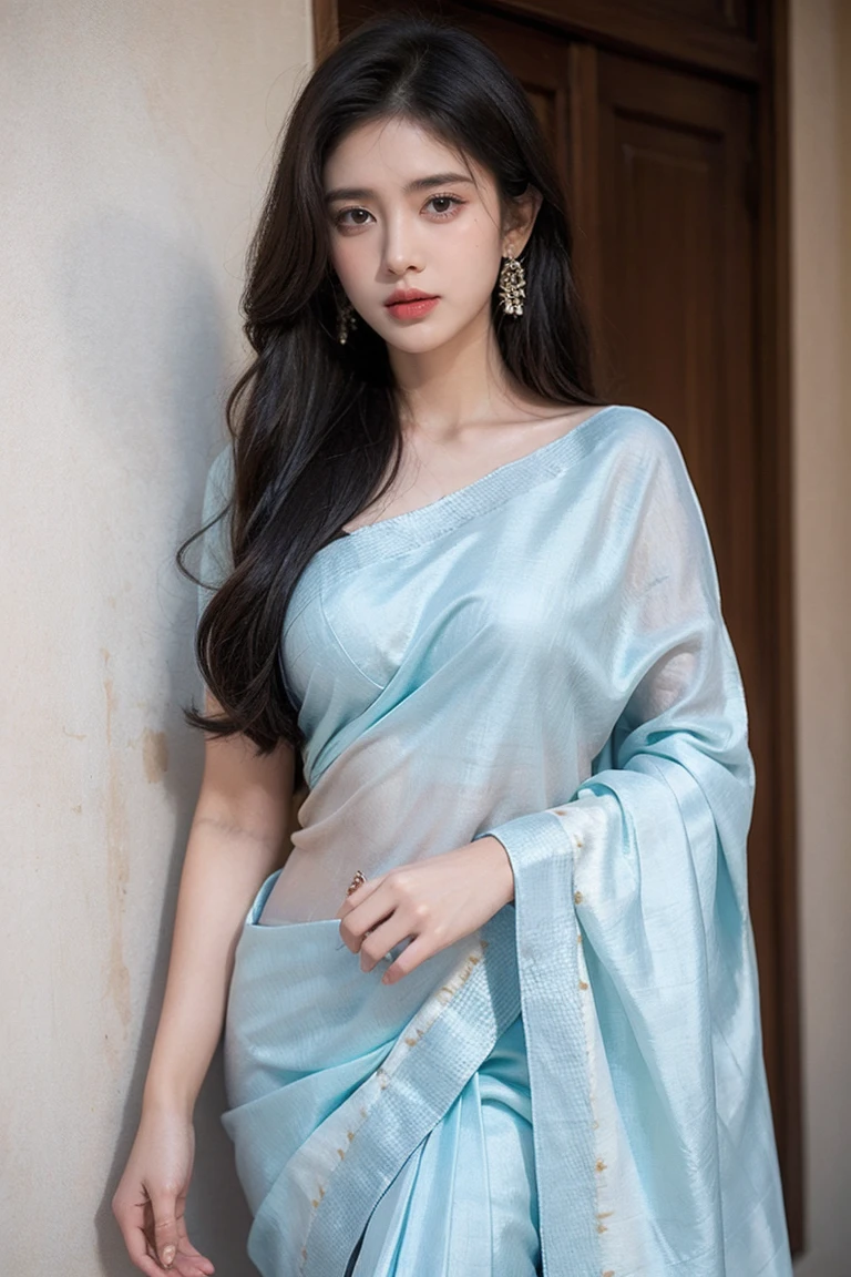 White tie-dyed silk saree with white, brown and aquamarine Nakshi Kantha embroidery. Comes with matching unstitched blouse piece attached at the end of saree. Blouse shown in the photo is a styling suggestion, it is not a part of the actual product.