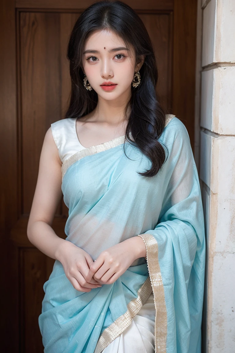 White tie-dyed silk saree with white, brown and aquamarine Nakshi Kantha embroidery. Comes with matching unstitched blouse piece attached at the end of saree. Blouse shown in the photo is a styling suggestion, it is not a part of the actual product.