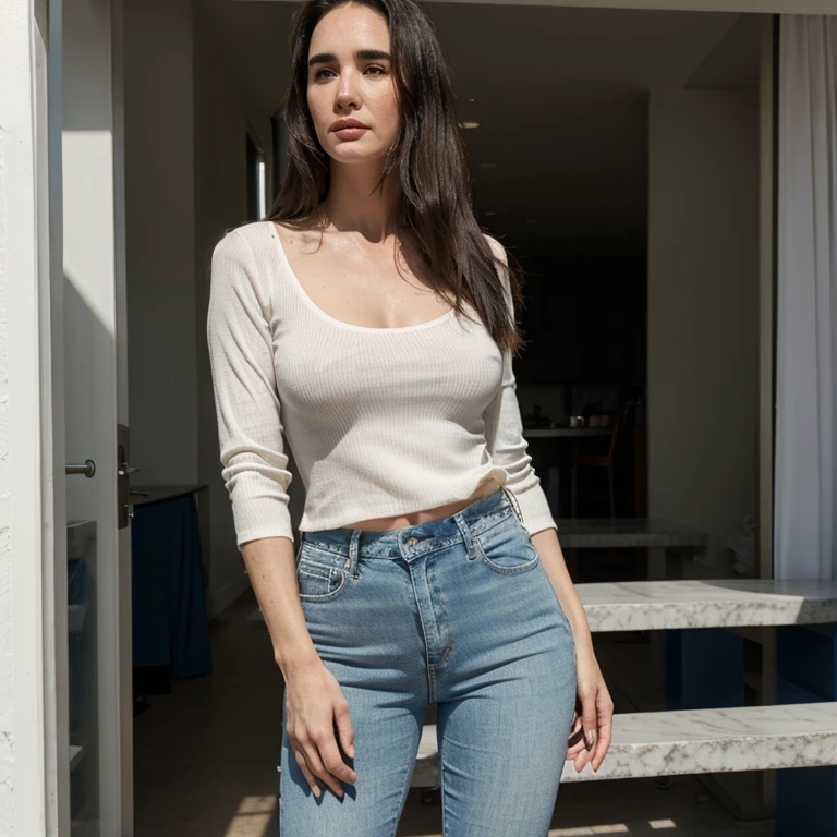 Jennifer Connelly dressed in a top and skinny jeans