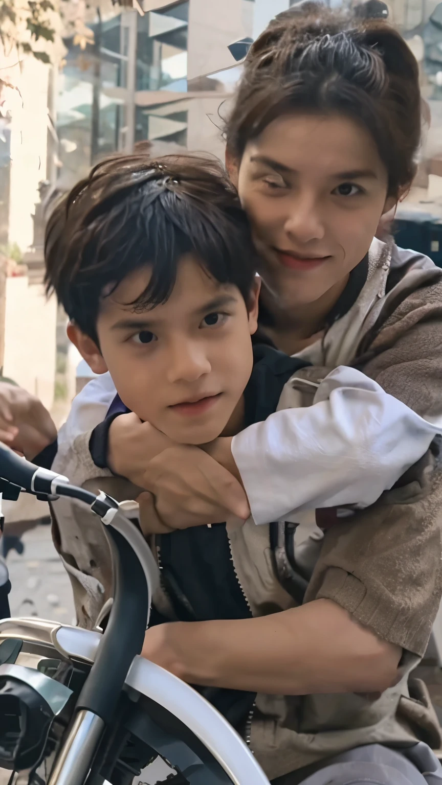 A boy set on th bike with a father