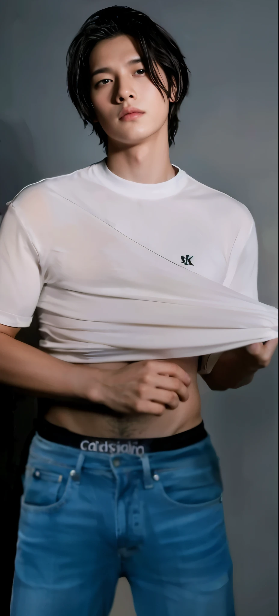 Boy lifts his shirt