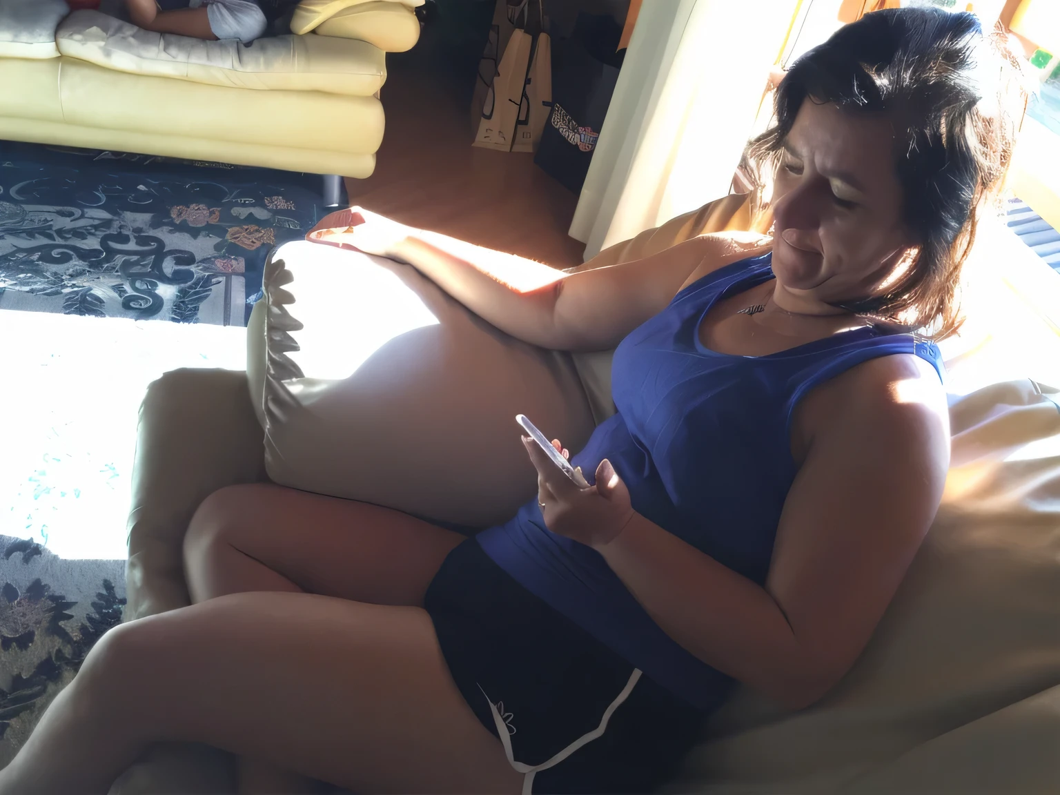 woman sitting on a couch using a cell phone, checking her phone, checking her cell phone, goddess checking her phone, sitting on the couch, mid-morning lighting, her navel is exposed, sitting on a couch, bright sunlight, afternoon light solar, sitting on the sofa, side photo, afternoon sun, sun behind her, looking distracted, wearing black shorts and a regatta t-shirt. High resolution, high quality, full body photo, 8k.