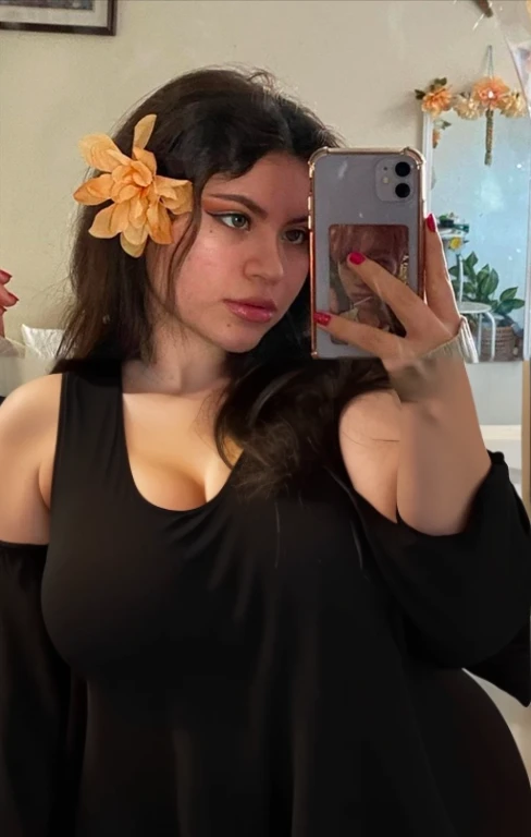 there is a full body of a woman taking a picture of herself with her cell phone, very very low quality picture, flower in her hair, headshot profile picture, selfie of a young woman, low quality photo, lily frank, her face looks like an orchid, Big tits, huge tits, no clothes, sexy, cute, minimal clothes, thick, bbw, chubby stomach, thick nipples, nipple piercings, large areola, hard nipples, piercing through shirt, nipples hard through shirt, busty, major cleavage, naked, ripping through top, spilling over sides, bra too tight, giant tits, extra wide hips, upper body zoom in, showing off huge , fat stomach, see through top, fat bbw, large areola showing, major cleavage, latina, down to stomach, wide hips, sexy, upper body zoom, showing off , top half only, showing only upper, showing off cleavage, shown down to hips, extended background, no empty space in background, fill all pixels, nude girl in bedroom, wearing only a bra, background extended