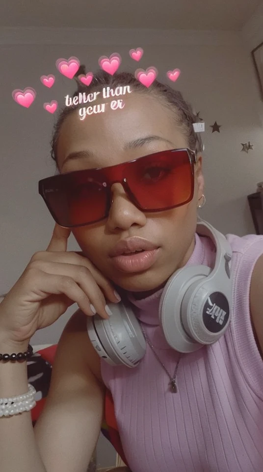 Black longer hair,brown eyes,glasses up.