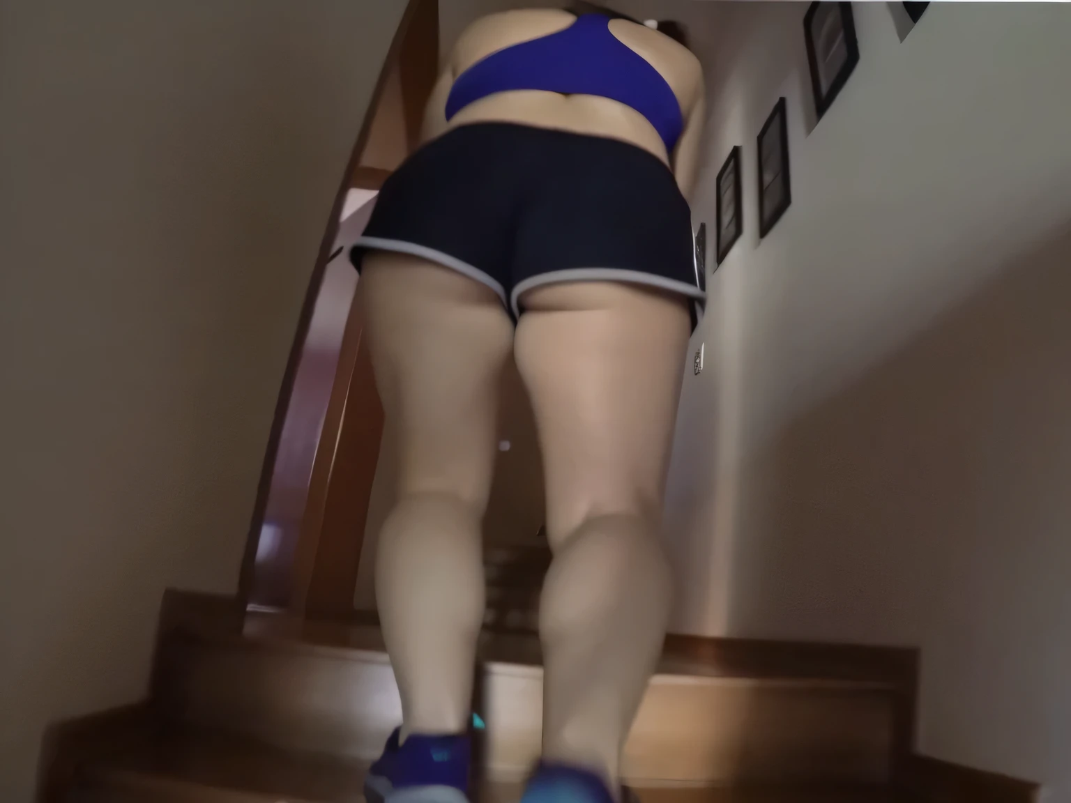 RAW, Best quality, high resolution, Masterpiece: 1.3, Beautiful brunette. Best quality, high resolution. Realistic, detailed and complete woman in a blue top and very short black shorts climbing a flight of stairs, side view of her taking steps, in shorts, working out, exposed thighs!!!, training, stairs, thighs!!!!!!, thighs! !!, fitness bodysuit, sports bra and dark blue shorts, toned legs. She is around 35 years old, a woman in good physical condition. Masterpiece, best quality, (best quality), realistic lighting, 8k.