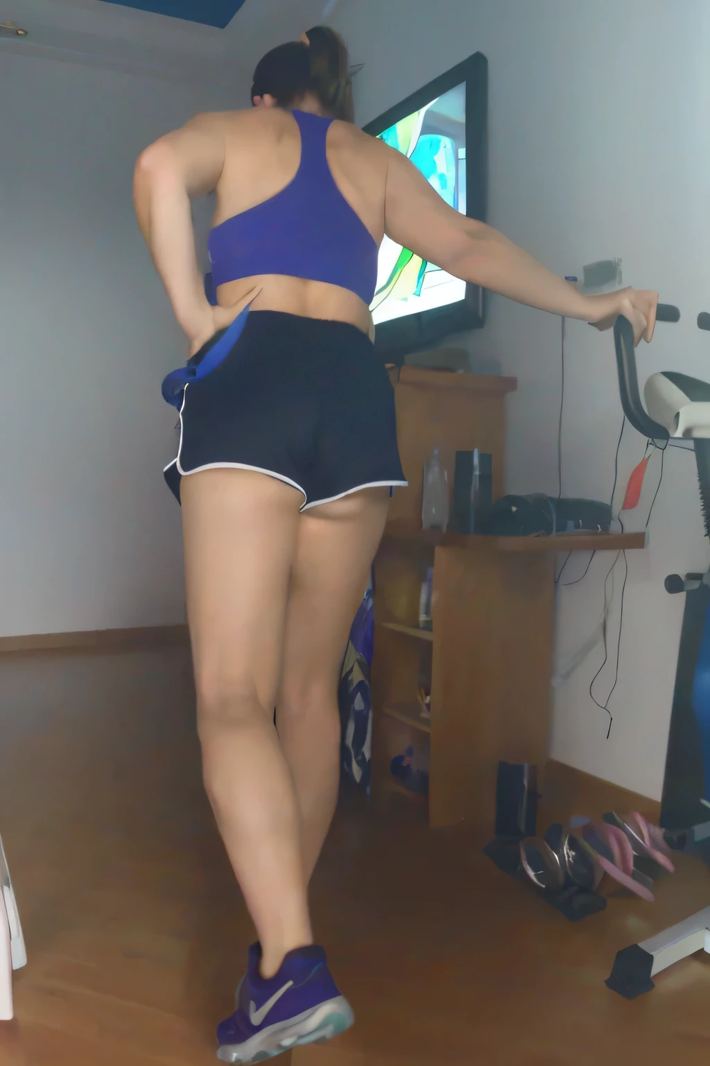 RAW, Best quality, high resolution, Masterpiece: 1.3, Beautiful brunette. Best quality, high resolution. Realistic, detailed, full-length woman in a blue top and very short black short shorts woman in a blue top and black shorts is using an exercise bike, in shorts, legs and arms, long shot of the back, sports bra and dark blue shorts, bra sportswear and shorts, shot from behind, working out, toned legs, thighs!!!!!!, long shot from the back, thighs!!!, adjusted photo, legs visible, view from behind, shot from behind, in shorts, working out, exposed thighs!!!, workout, stairs, thighs!!!!!!, thighs!!!, fitness body, sports bra and dark blue shorts, toned legs. She is around 35 years old, a woman in good physical condition. Masterpiece, best quality, (best quality), realistic lighting, 8k.
