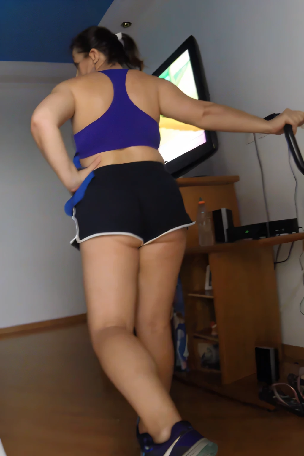 RAW, Best quality, high resolution, Masterpiece: 1.3, Beautiful brunette. Best quality, high resolution. Realistic, detailed, full-length woman in a blue top and very short black short shorts woman in a blue top and black shorts is using an exercise bike, in shorts, legs and arms, long shot of the back, sports bra and dark blue shorts, bra sportswear and shorts, shot from behind, working out, toned legs, thighs!!!!!!, long shot from the back, thighs!!!, adjusted photo, legs visible, view from behind, shot from behind, in shorts, working out, exposed thighs!!!, workout, stairs, thighs!!!!!!, thighs!!!, fitness body, sports bra and dark blue shorts, toned legs. She is around 35 years old, a woman in good physical condition. Masterpiece, best quality, (best quality), realistic lighting, 8k.