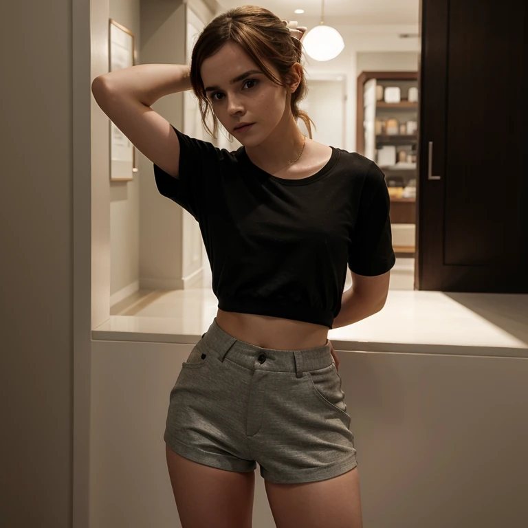 Emma Watson dressed in a line shirt with tight shorts
