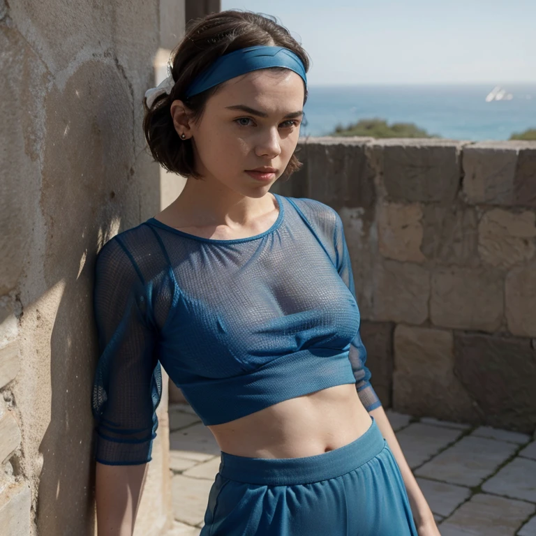Daisy Ridley dressed in blue sheer top with pants wearing a headband