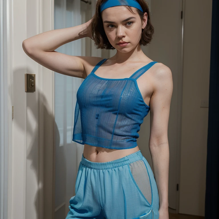 Daisy Ridley dressed in blue sheer top with pants wearing a headband