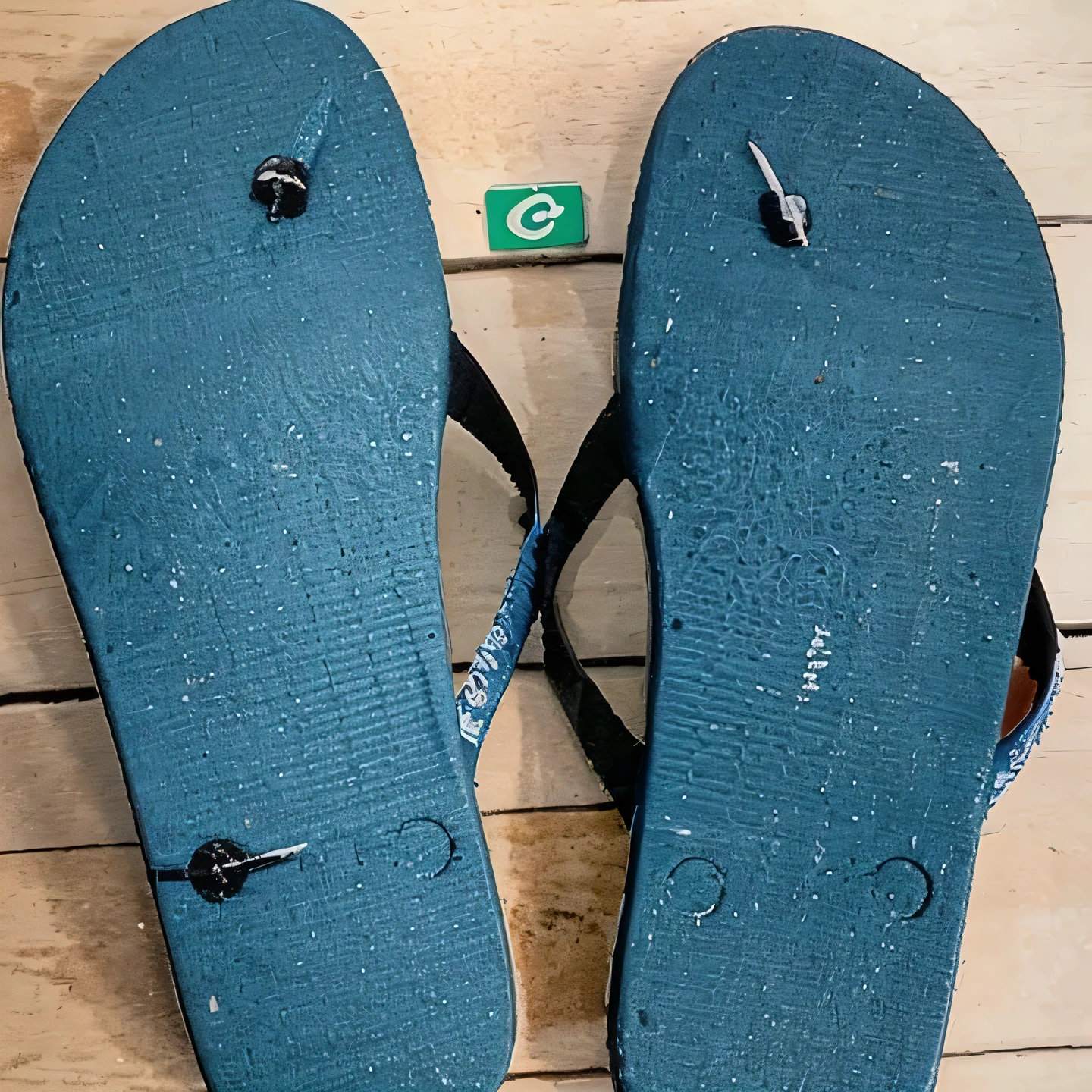 Havaianas style flip-flop sandals, patched with a nail