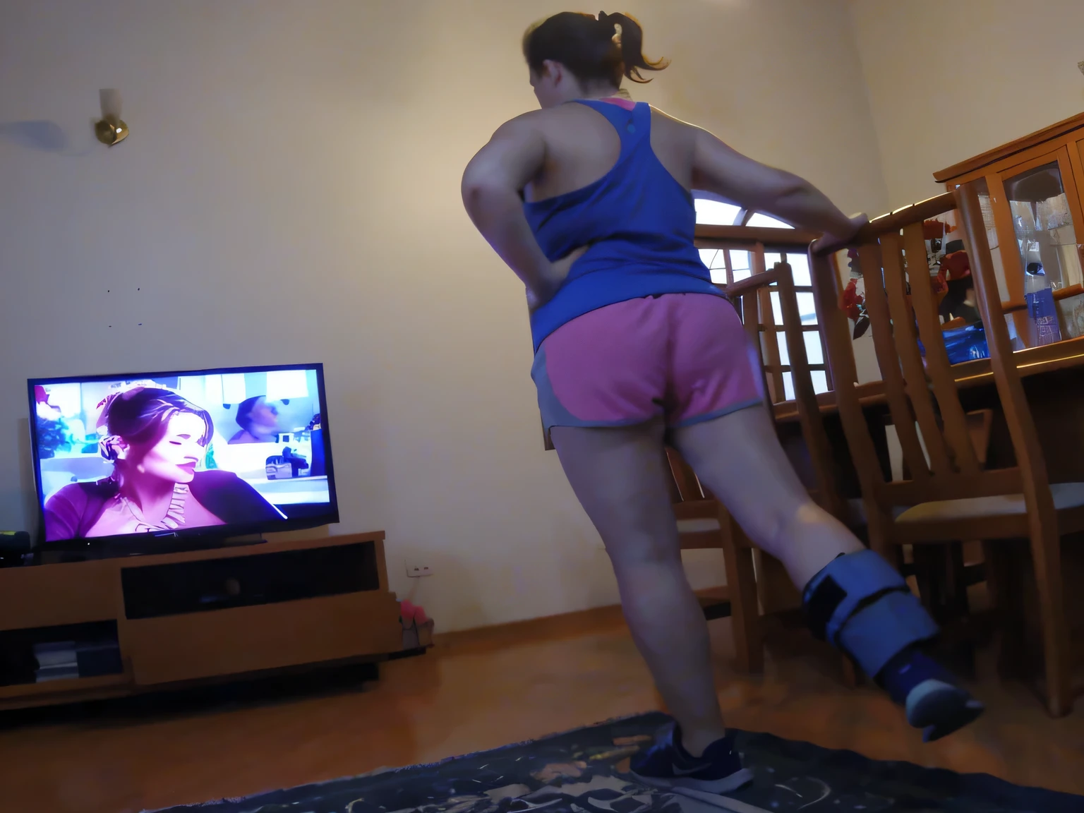 woman in pink shorts in a room, very short pink shorts, in shorts, short pink shorts, short shorts, pink shorts and pink short t-shirt, sexy girl wearing shorts, shot from behind, close-up from behind, rear-shot, shot from behind, medium shot taken from behind, shorts cut down, rear view. Best quality, high resolution. Realistic, detailed, full body woman in pink tank top and pink short shorts, with pink tank top and pink shorts, toned legs, thighs!!!!!!, A high resolution, (photographically realistic), Beautiful girl, Sexy Pose, 8K , NFSW. Masterpiece, best quality, (best quality), realistic lighting, 8k. Pink roses are in the foreground of a garden. Best quality, high resolution, Masterpiece: 1.3, A high resolution, (photographically realistic). She is around 35 years old, a woman in good physical condition.
