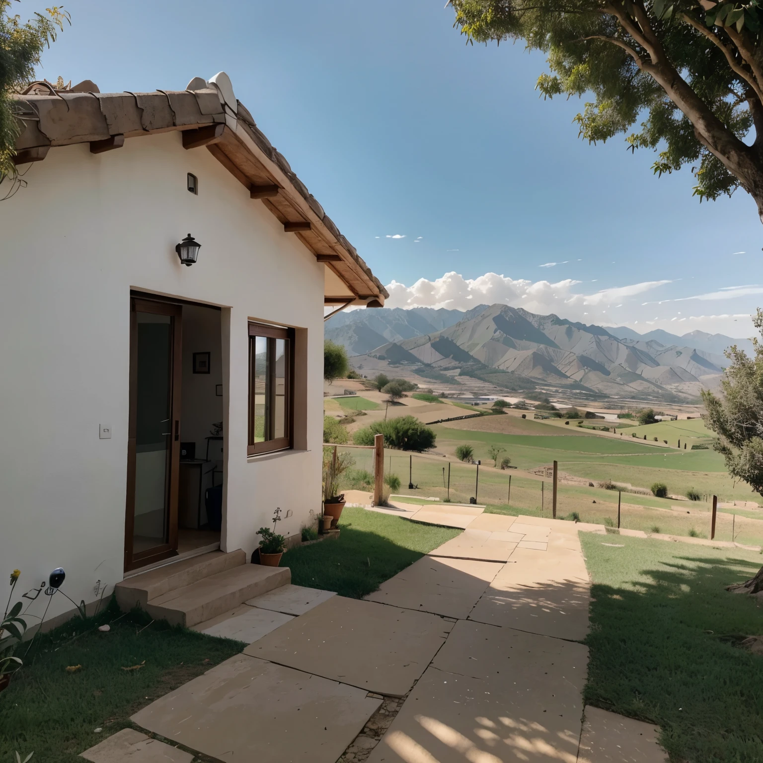 Una hermos casa vista desde el exterior, ubicada sobre una colina con vista al valle al atardecer