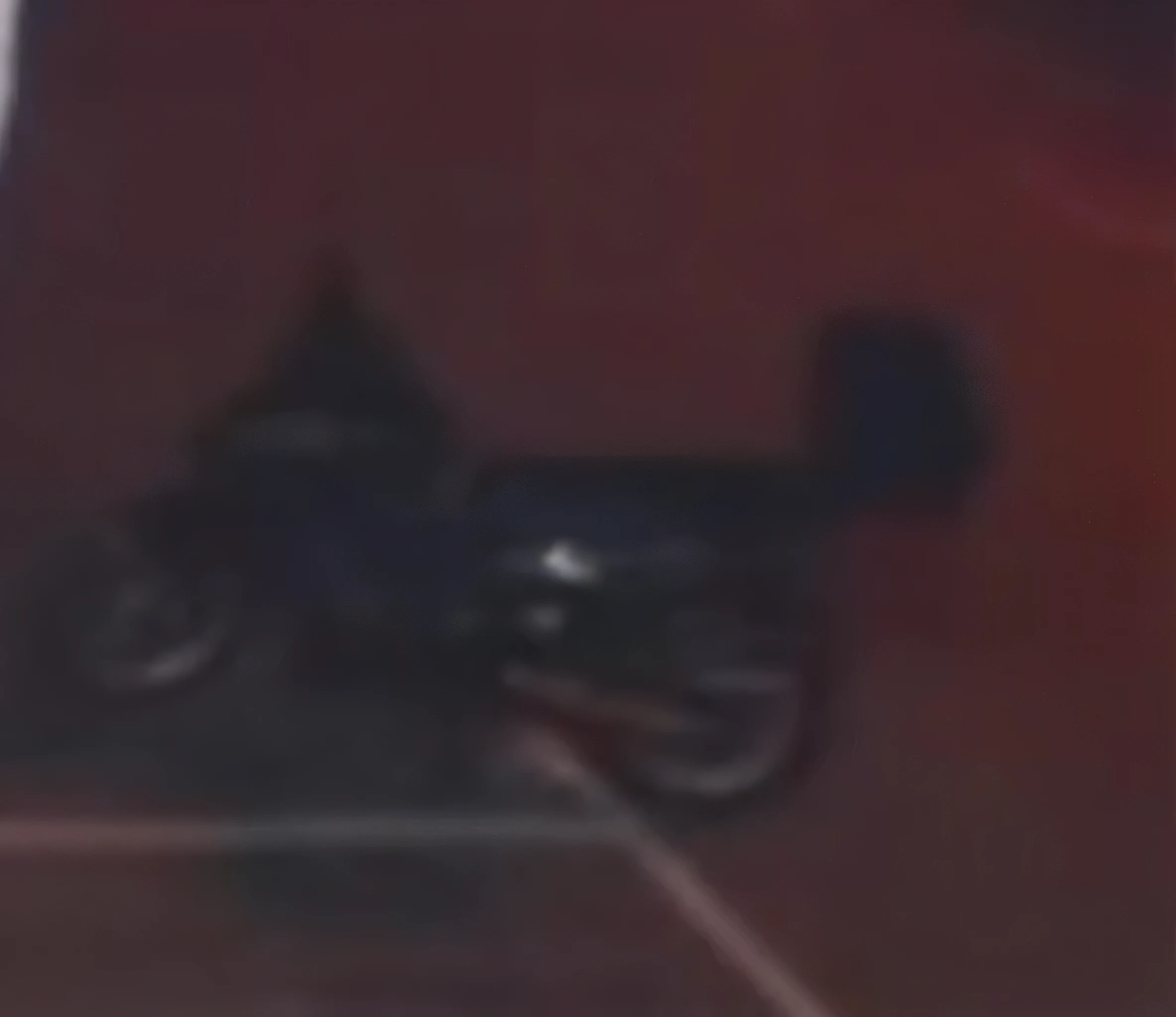 there is a blurry image of a motorcycle on a street, grainy footage, grainy low quality, low quality footage, blurry footage, very grainy image, zoomed out shot, night time footage, moped, leaked footage, low quality grainy, motorcycle, very very low quality picture, very blurry, vhs footage still, grainy low quality photograph