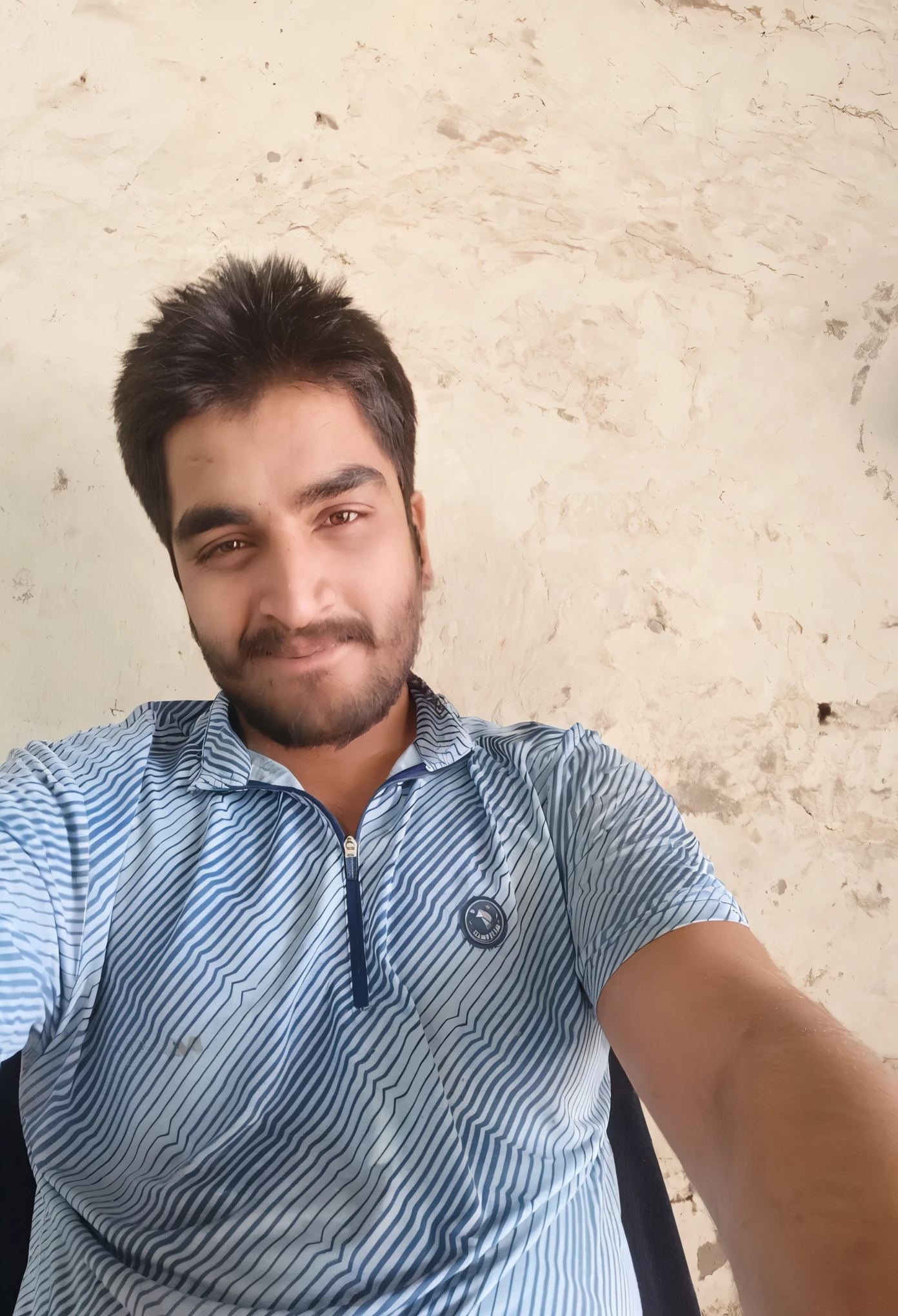 arafed man sitting in a chair with a cell phone in his hand, very very low quality picture, without beard, 8k selfie photograph, with accurate face, selfie photo, around 1 9 years old, with a small beard, khyzyl saleem, without beard and mustache, without helmet, kyza saleem, taken with sony a7r camera