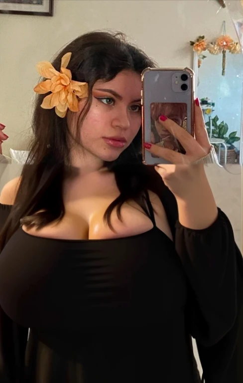 there is a full body of a woman taking a picture of herself with her cell phone, very very low quality picture, flower in her hair, headshot profile picture, selfie of a young woman, low quality photo, lily frank, her face looks like an orchid, Big tits, huge tits, no clothes, sexy, cute, minimal clothes, thick, bbw, chubby stomach, thick nipples, nipple piercings, large areola, hard nipples, piercing through shirt, nipples hard through shirt, busty, major cleavage, naked, ripping through top, spilling over sides, bra too tight, giant , extra wide hips, upper body zoom in, showing off huge , fat stomach, see through top, fat bbw, large areola showing, major cleavage, latina, down to stomach, wide hips, sexy, upper body zoom, showing off , top half only, showing only upper, showing off cleavage, shown down to hips, extended background, no empty space in background, fill all pixels, nude girl in bedroom, wearing only a bra, nude, naked, background extended