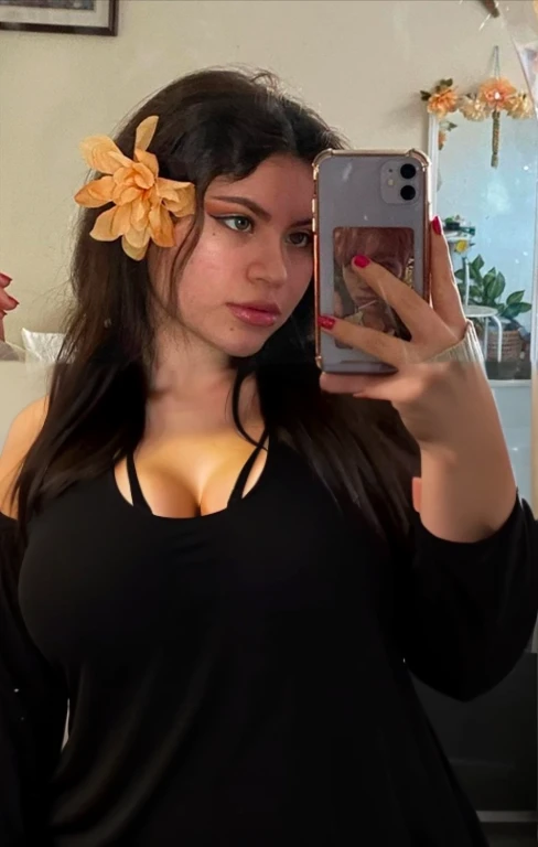 there is a full body of a woman taking a picture of herself with her cell phone, very very low quality picture, flower in her hair, headshot profile picture, selfie of a young woman, low quality photo, lily frank, her face looks like an orchid, Big tits, huge tits, no clothes, sexy, cute, minimal clothes, thick, bbw, chubby stomach, thick nipples, nipple piercings, large areola, hard nipples, piercing through shirt, nipples hard through shirt, busty, major cleavage, naked, ripping through top, spilling over sides, bra too tight, giant , extra wide hips, upper body zoom in, showing off huge , fat stomach, see through top, fat bbw, large areola showing, major cleavage, latina, down to stomach, wide hips, sexy, upper body zoom, showing off , top half only, showing only upper, showing off cleavage, shown down to hips, extended background, no empty space in background, fill all pixels, nude girl in bedroom, wearing only a bra, nude, naked, background extended