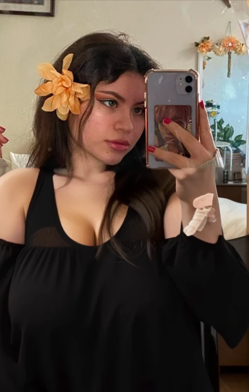 there is a full body of a woman taking a picture of herself with her cell phone, very very low quality picture, flower in her hair, headshot profile picture, selfie of a young woman, low quality photo, lily frank, her face looks like an orchid, Big tits, huge tits, no clothes, sexy, cute, minimal clothes, thick, bbw, chubby stomach, thick nipples, nipple piercings, large areola, hard nipples, piercing through shirt, nipples hard through shirt, busty, major cleavage, naked, ripping through top, spilling over sides, bra too tight, giant , extra wide hips, upper body zoom in, showing off huge , fat stomach, see through top, fat bbw, large areola showing, major cleavage, latina, down to stomach, wide hips, sexy, upper body zoom, showing off , top half only, showing only upper, showing off cleavage, shown down to hips, extended background, no empty space in background, fill all pixels, nude girl in bedroom, wearing only a bra, nude, naked, background extended