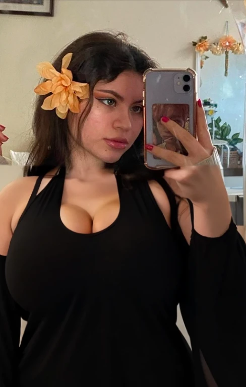 there is a full body of a woman taking a picture of herself with her cell phone, very very low quality picture, flower in her hair, headshot profile picture, selfie of a young woman, low quality photo, lily frank, her face looks like an orchid, Big tits, huge tits, no clothes, sexy, cute, minimal clothes, thick, bbw, chubby stomach, thick nipples, nipple piercings, large areola, hard nipples, piercing through shirt, nipples hard through shirt, busty, major cleavage, naked, ripping through top, spilling over sides, bra too tight, giant , extra wide hips, upper body zoom in, showing off huge , fat stomach, see through top, fat bbw, large areola showing, major cleavage, latina, down to stomach, wide hips, sexy, upper body zoom, showing off , top half only, showing only upper, showing off cleavage, shown down to hips, extended background, no empty space in background, fill all pixels, nude girl in bedroom, wearing only a bra, nude, naked, background extended