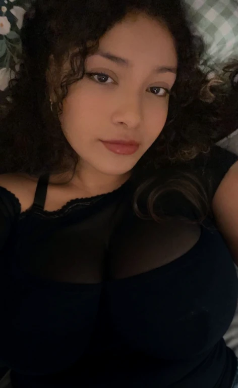there is a woman laying in bed with a cell phone, taken in the early 2020s, profile image, around 1 , selfie of a young woman, 18 years old, alanis guillen, headshot profile picture, profile pic, 30 years old woman, 3 0 years old woman, her face framed with curls, Big tits, huge tits, no clothes, sexy, cute, minimal clothes, thick, bbw, chubby stomach, thick nipples, nipple piercings, large areola, hard nipples, piercing through shirt, nipples hard through shirt, busty, major cleavage, naked, ripping through top, spilling over sides, bra too tight, giant , extra wide hips, upper body zoom in, showing off huge , fat stomach, see through top, fat bbw, large areola showing, major cleavage, latina, down to stomach, wide hips, sexy, upper body zoom, thick arm, showing off , top half only, showing only upper, only a bra, showing off cleavage