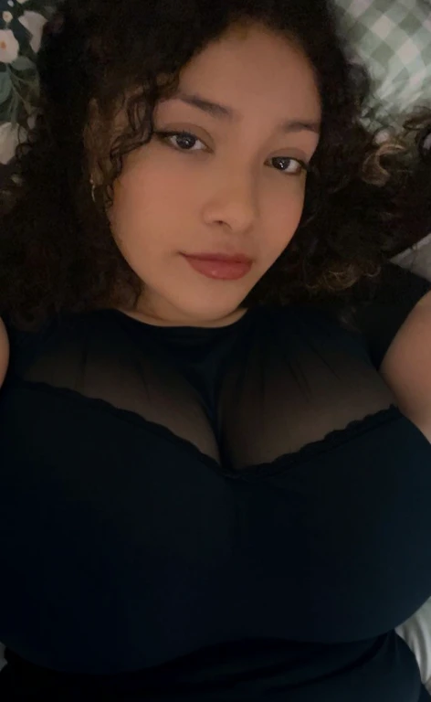 there is a woman laying in bed with a cell phone, taken in the early 2020s, profile image, around 1 , selfie of a young woman, 18 years old, alanis guillen, headshot profile picture, profile pic, 30 years old woman, 3 0 years old woman, her face framed with curls, Big tits, huge tits, no clothes, sexy, cute, minimal clothes, thick, bbw, chubby stomach, thick nipples, nipple piercings, large areola, hard nipples, piercing through shirt, nipples hard through shirt, busty, major cleavage, naked, ripping through top, spilling over sides, bra too tight, giant , extra wide hips, upper body zoom in, showing off huge , fat stomach, see through top, fat bbw, large areola showing, major cleavage, latina, down to stomach, wide hips, sexy, upper body zoom, thick arm, showing off , top half only, showing only upper, only a bra, showing off cleavage