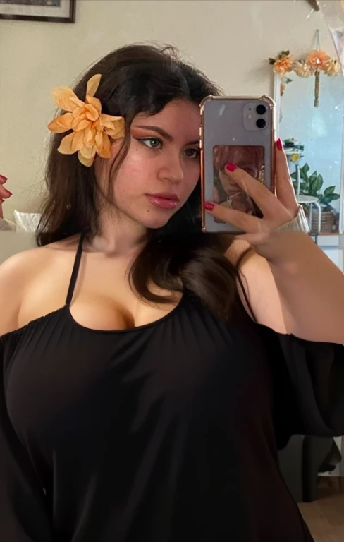 there is a full body of a woman taking a picture of herself with her cell phone, very very low quality picture, flower in her hair, headshot profile picture, selfie of a young woman, low quality photo, lily frank, her face looks like an orchid, Big tits, huge tits, no clothes, sexy, cute, minimal clothes, thick, bbw, chubby stomach, thick nipples, nipple piercings, large areola, hard nipples, piercing through shirt, nipples hard through shirt, busty, major cleavage, naked, ripping through top, spilling over sides, bra too tight, giant , extra wide hips, upper body zoom in, showing off huge , fat stomach, see through top, fat bbw, large areola showing, major cleavage, latina, down to stomach, wide hips, sexy, upper body zoom, showing off , top half only, showing only upper, showing off cleavage, shown down to hips, extended background, no empty space in background, fill all pixels, nude girl in bedroom, wearing only a bra, nude, naked, background extended