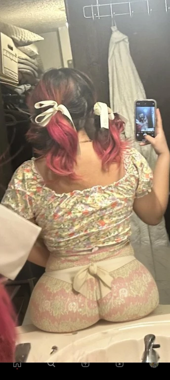 woman with pink hair taking a picture of herself in the mirror, wearing pink hair bow, pigtails, colorful pigtail, wearing underwear, with pink hair, wearing pink panties, back of the hair, roses in her hair, pink hair covered with hairpins, view from the back, curvy and bow, shot from the back, thick bow, insanely inflated hips, beautiful girl, big ass, huge ass, bbw, from behind, thick, thick thighs, wide hips, bbw, big tits, sideboob, giant ass, side view, big butt, round butt, tight underwear, underwear halfway off, underwear taking off, grabbing ass, ass spilling over underwear, too thick for clothes, side angle, chubby stomach, big , filipina, nude fat ass on sink