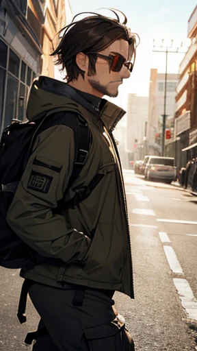 A man wearing survival gear and sunglasses is walking towards me.